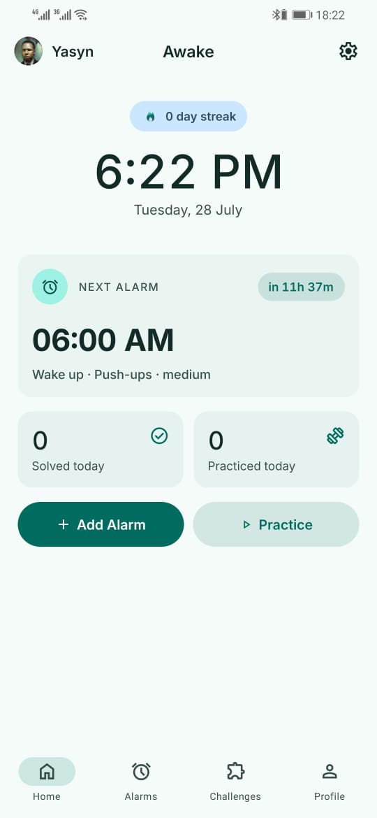 The Awake home screen: a 0 day streak pill, the current time, and a next-alarm card reading 06:00 AM, wake up, push-ups, medium.