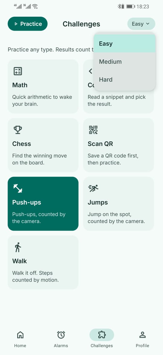 The challenges screen with cards for math, coding, chess, scan QR, push-ups, jumps and walk, and an open difficulty menu offering easy, medium and hard.
