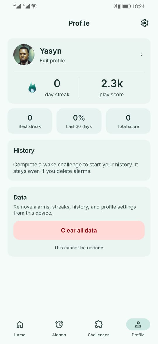The profile screen showing day streak and play score, tiles for best streak, last 30 days and total score, a history card, and a clear all data button.